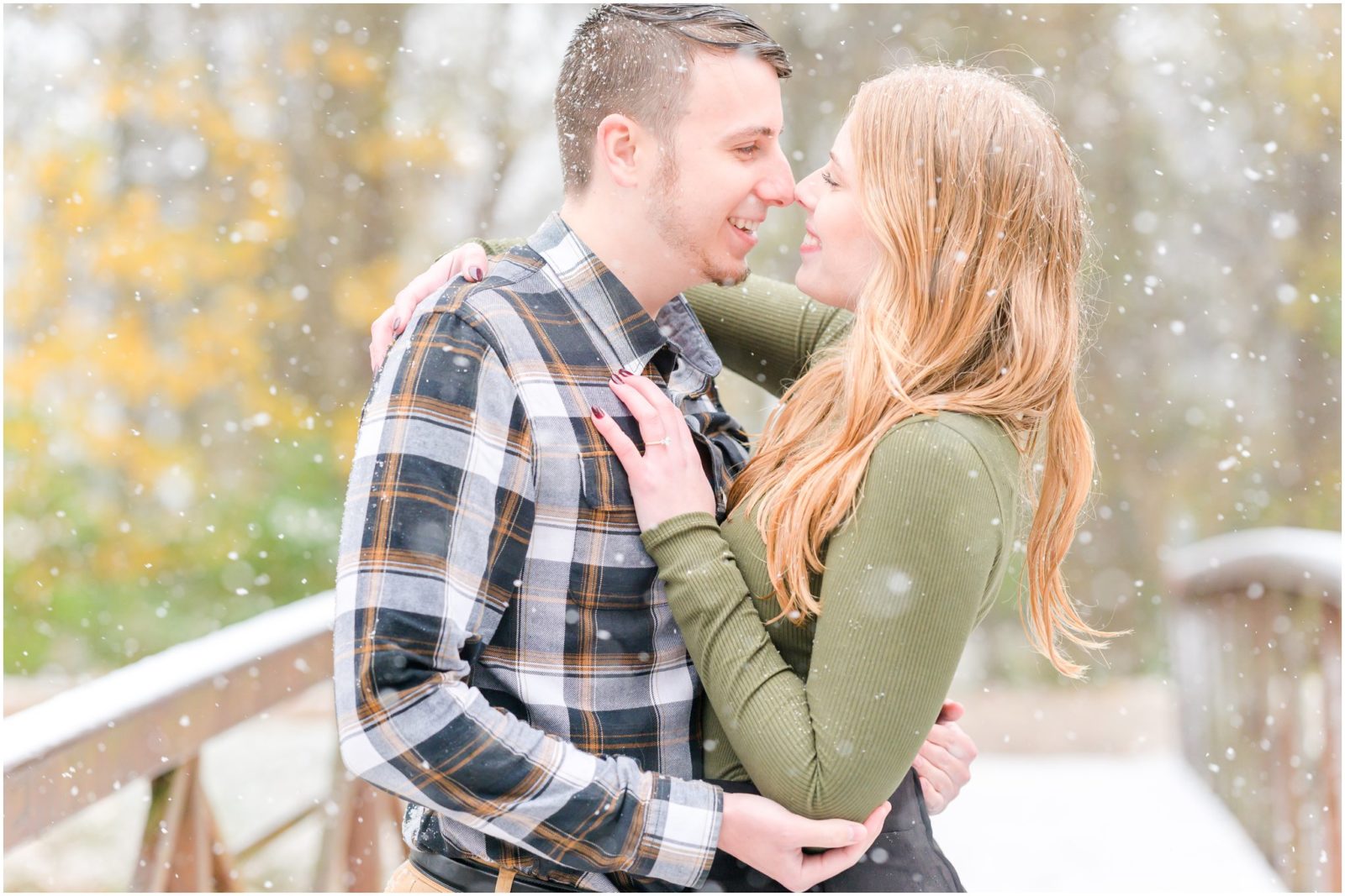 Couple nose to nose Holcomb Gardens engagement session in the snow