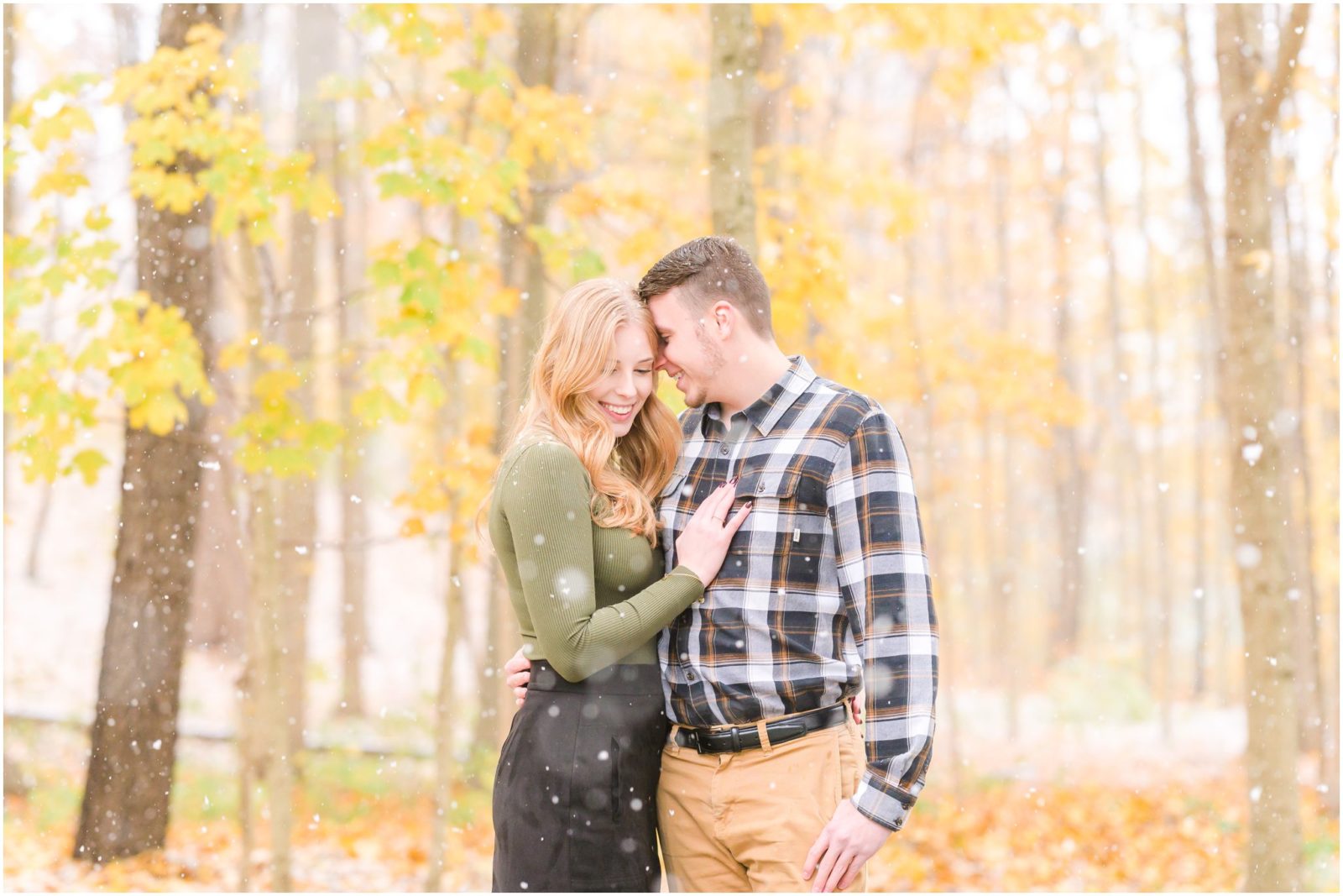 Couple nuzzling Holcomb Gardens engagement session in the snow