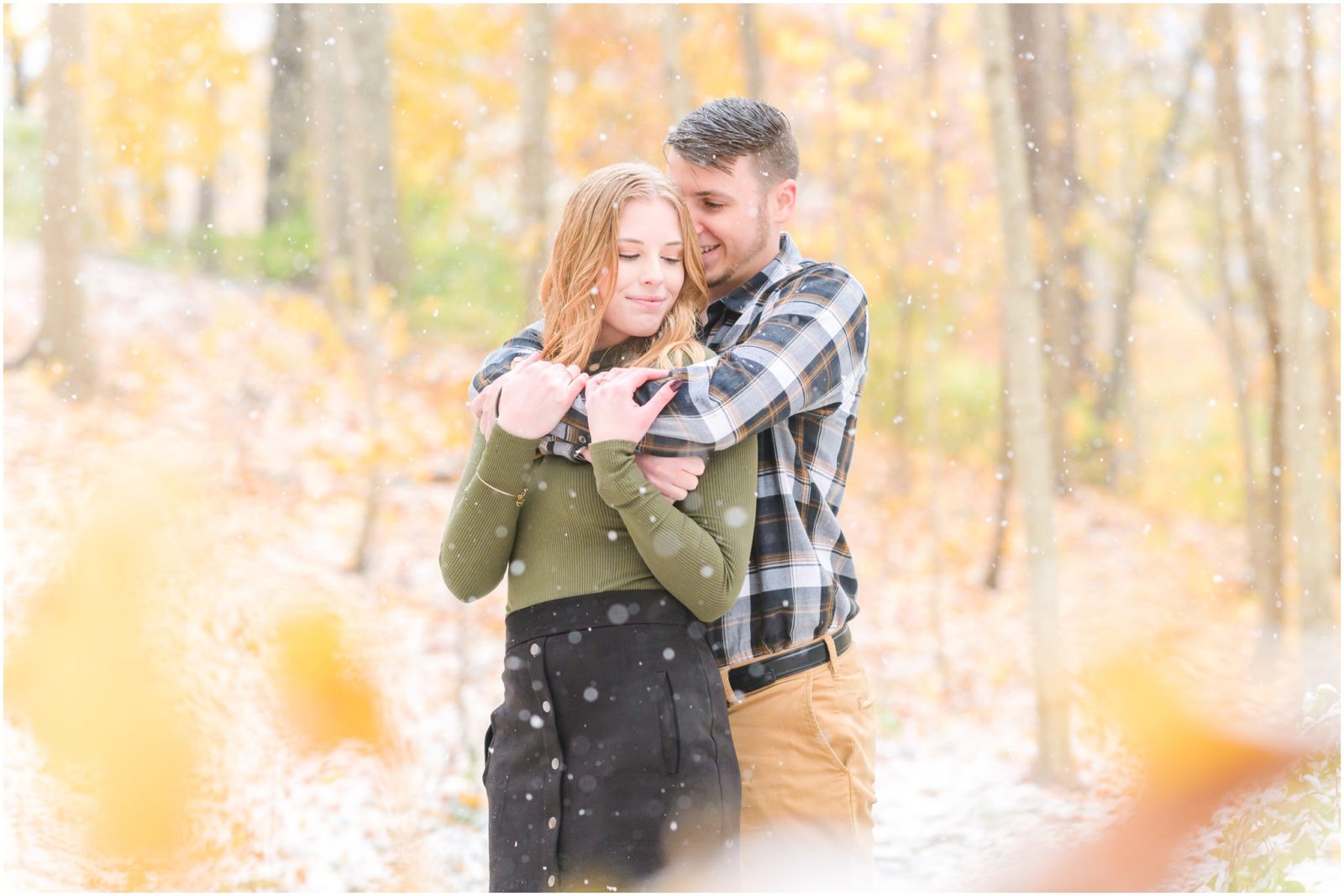 Couple nuzzling Holcomb Gardens engagement session in the snow