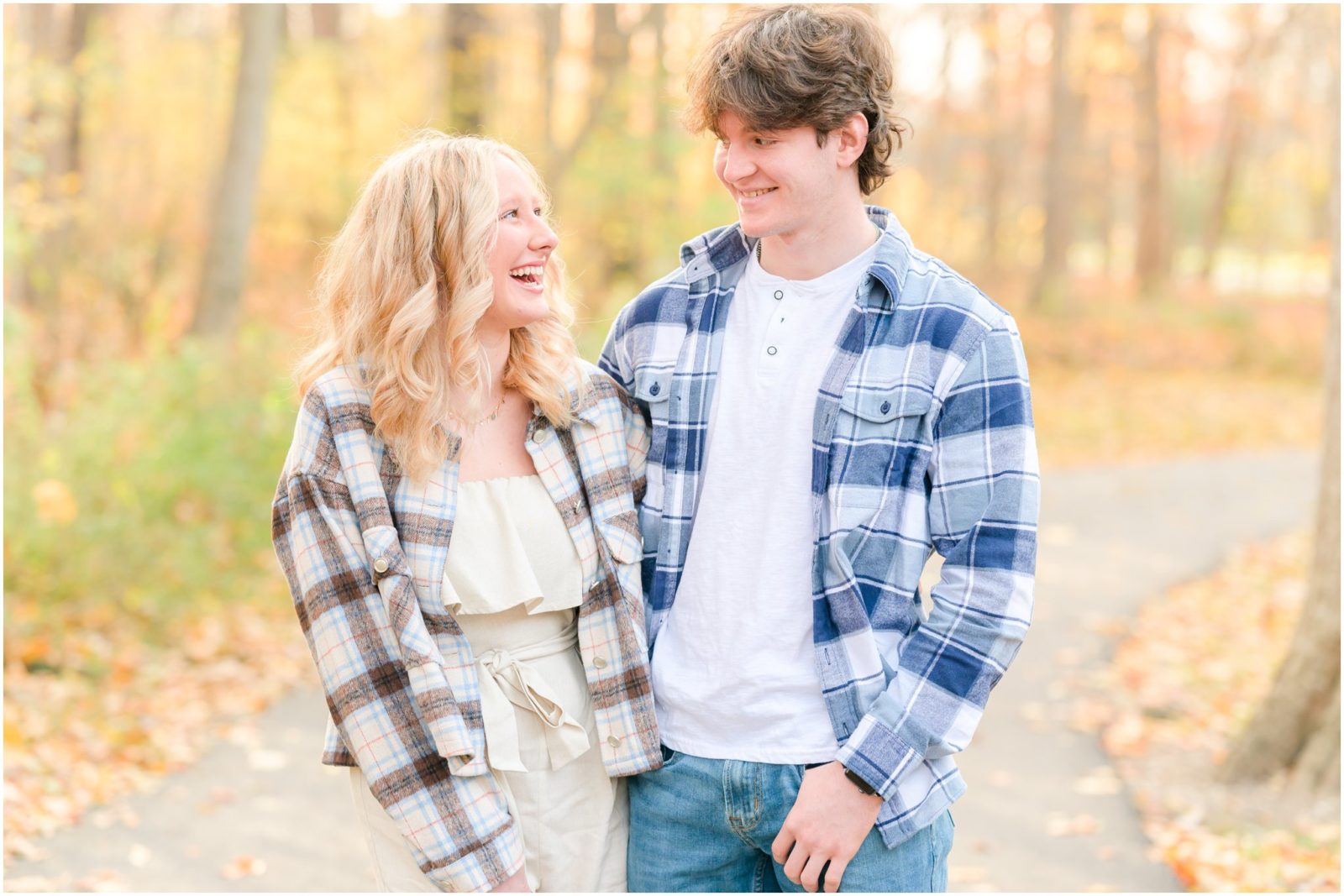 Brother and sister laughing together Holcomb Gardens senior session