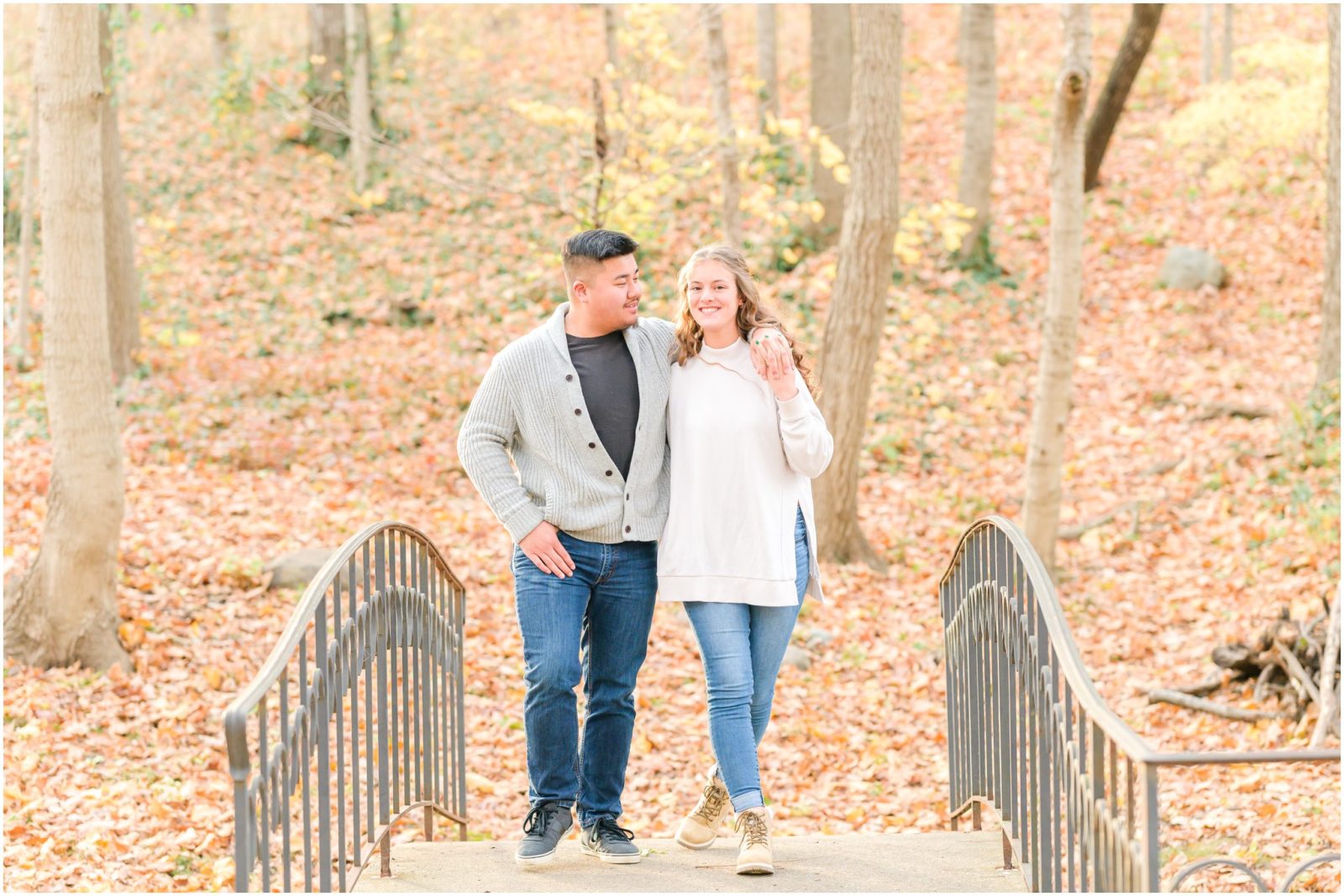 Couple walking and smiling Holcomb Gardens engagement session