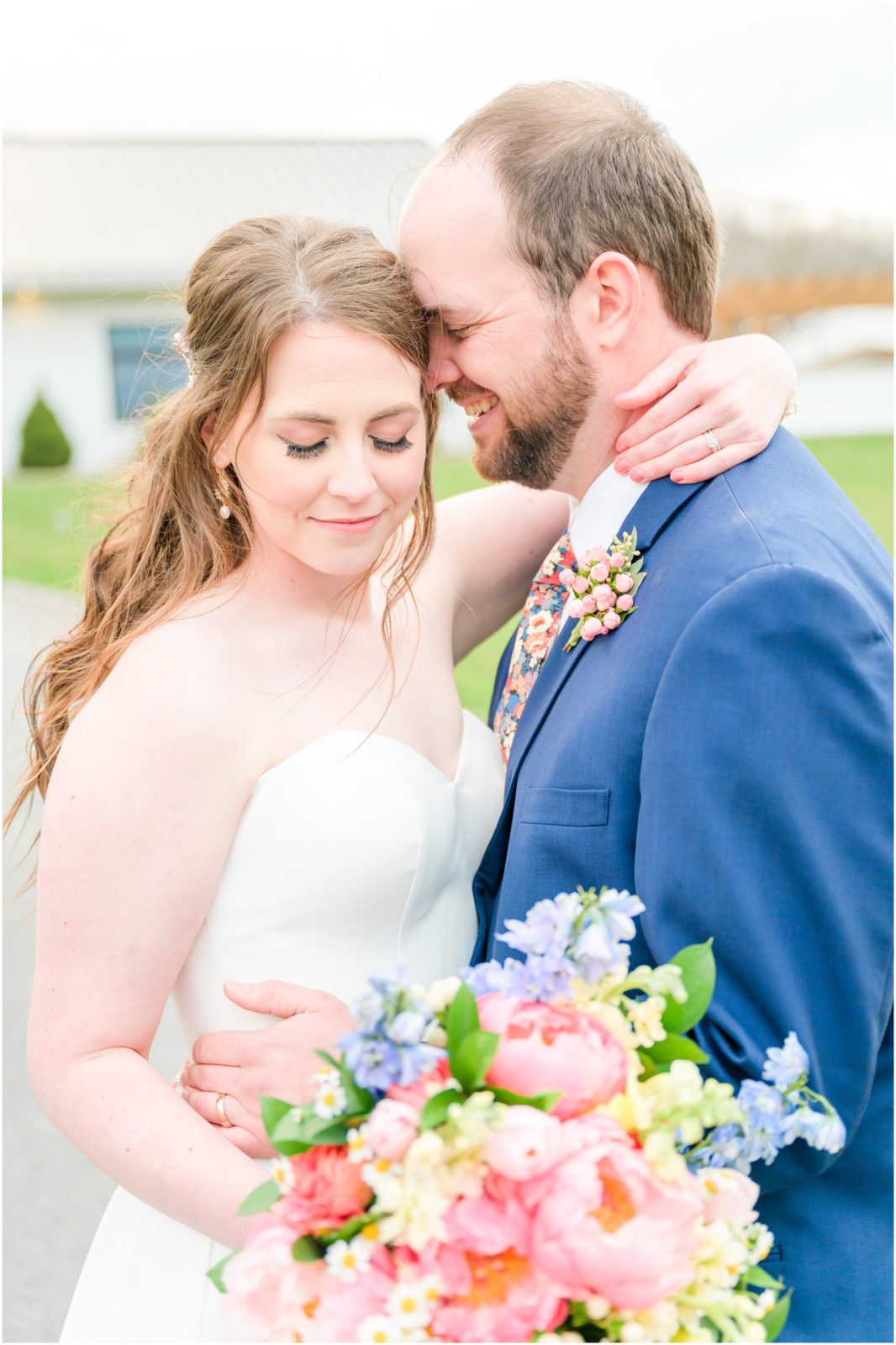 Bride and groom nuzzling The Wilds Venue spring wedding