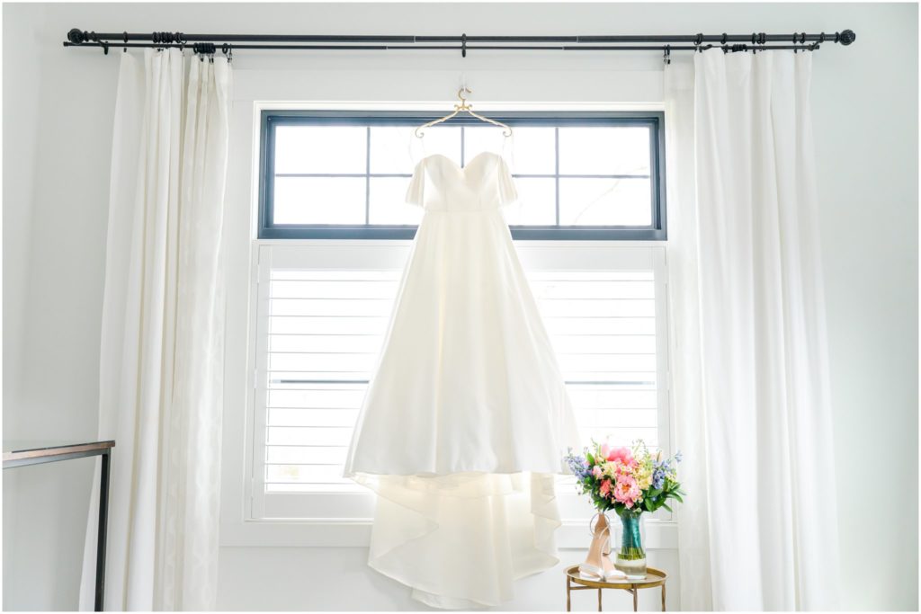 Dress shot in front of window The Wilds Venue spring wedding