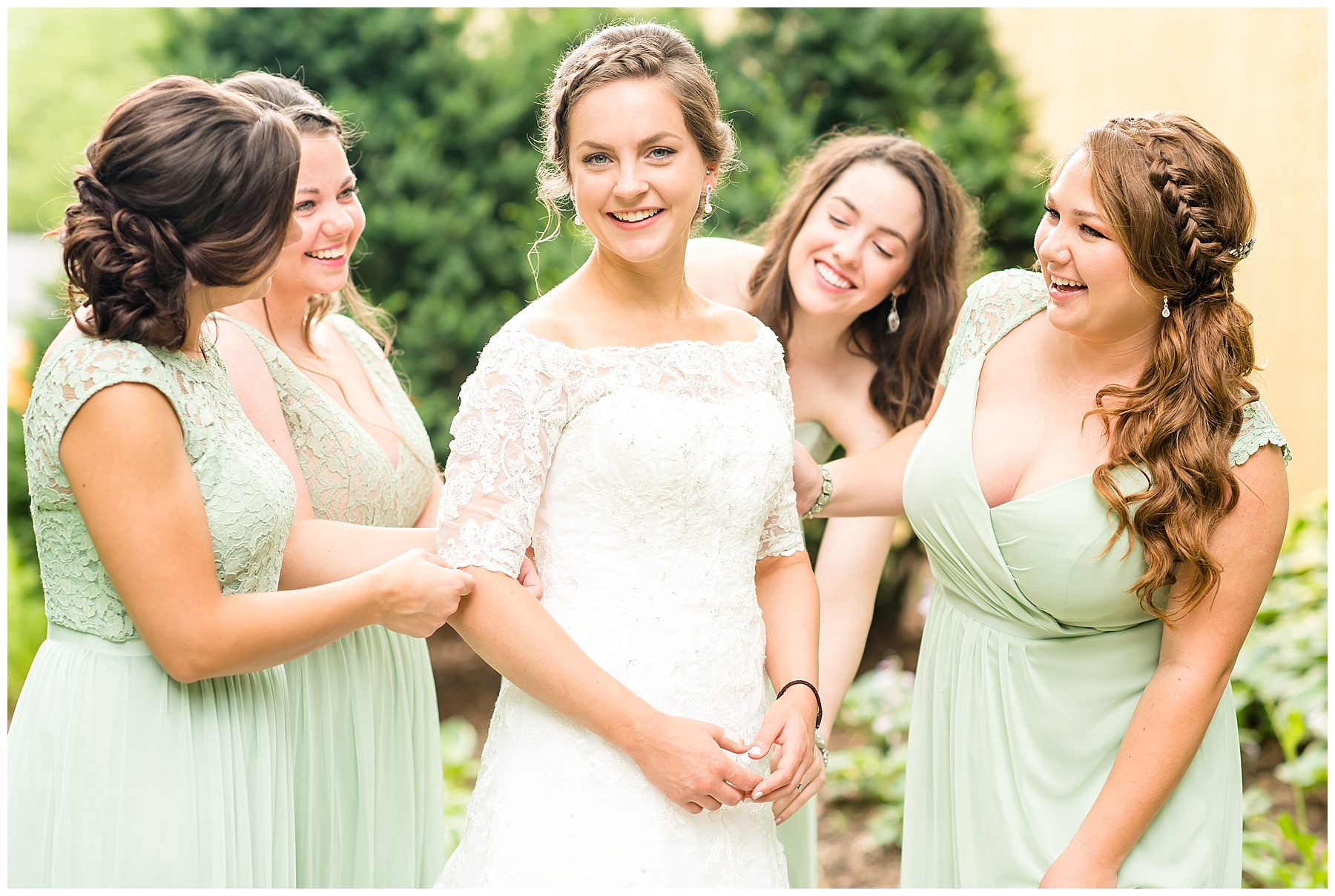 Bride being fluffed by bridesmaids in 2018 wedding photography favorites