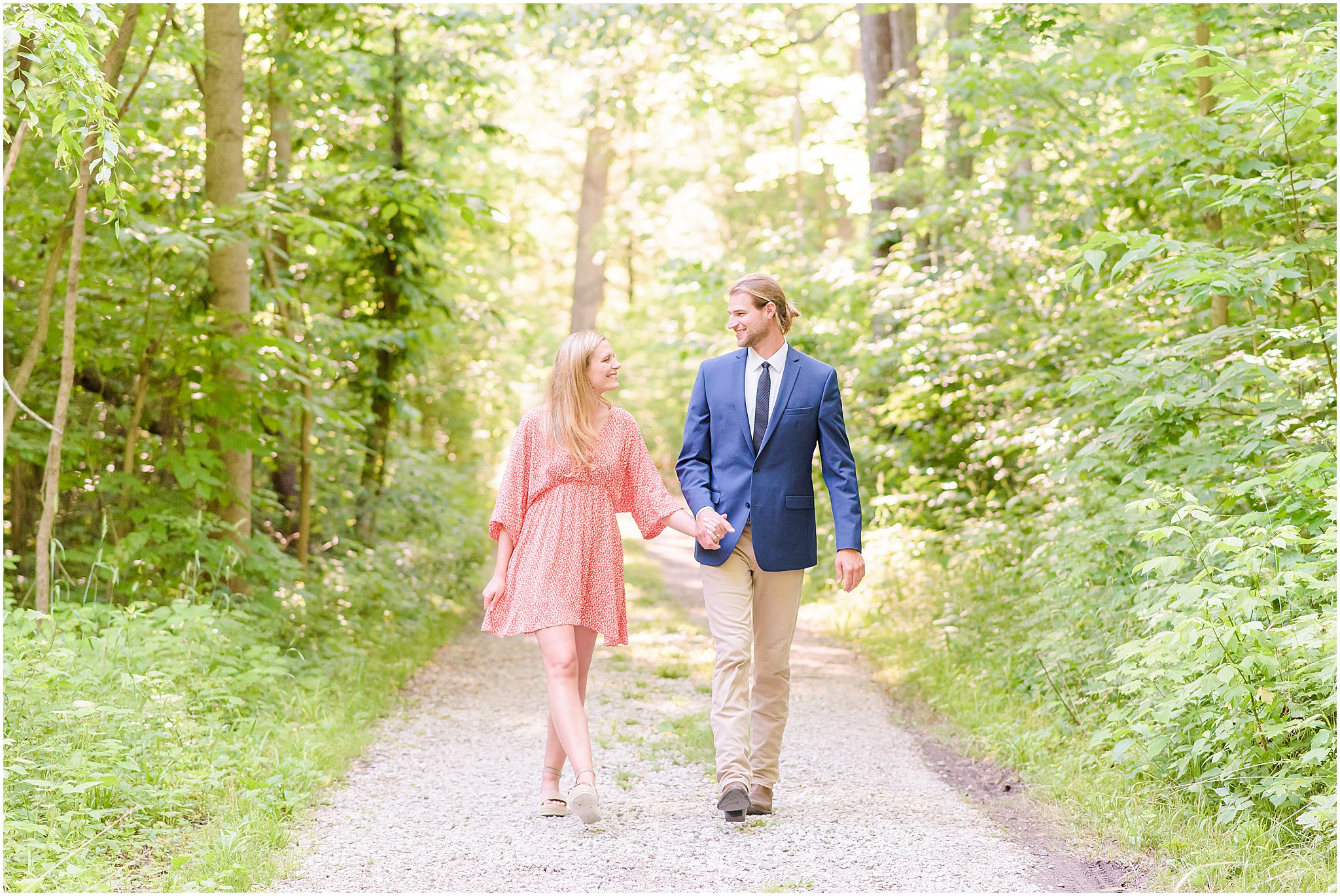 Couple holding hands and walking during Turkey Run State Park engagement session