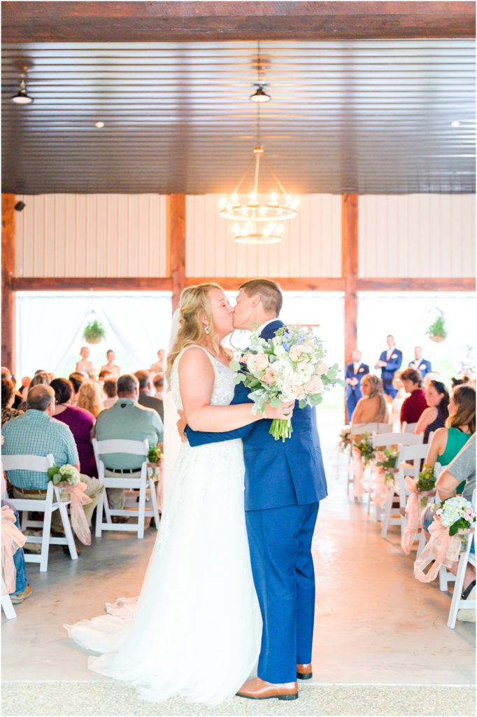 Recessional kiss Paoli Indiana Spring Wedding At Burton's Farmhouse