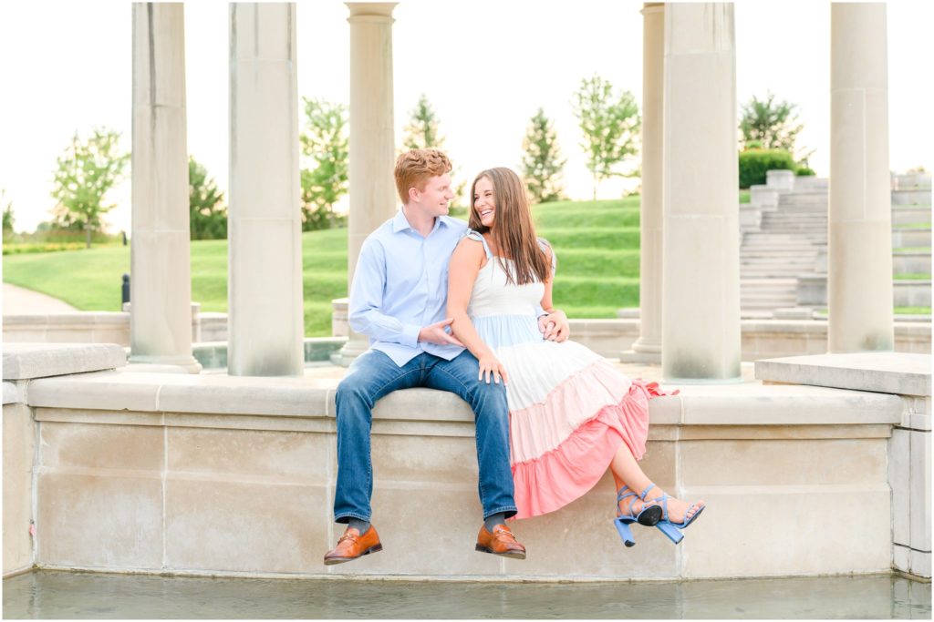 Couple sitting and cuddling Coxhall Gardens engagement session