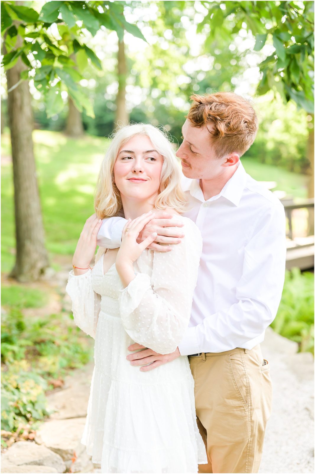 Couple nuzzling Oliver Winery engagement session