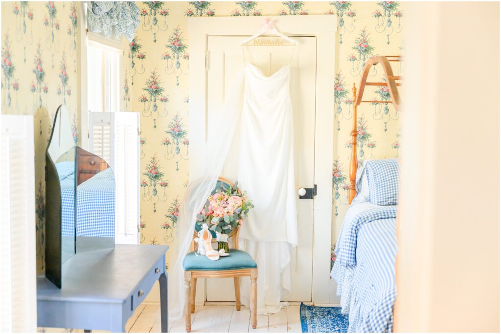Wedding detail photo featuring bridal shoes, jewelry, and florals.