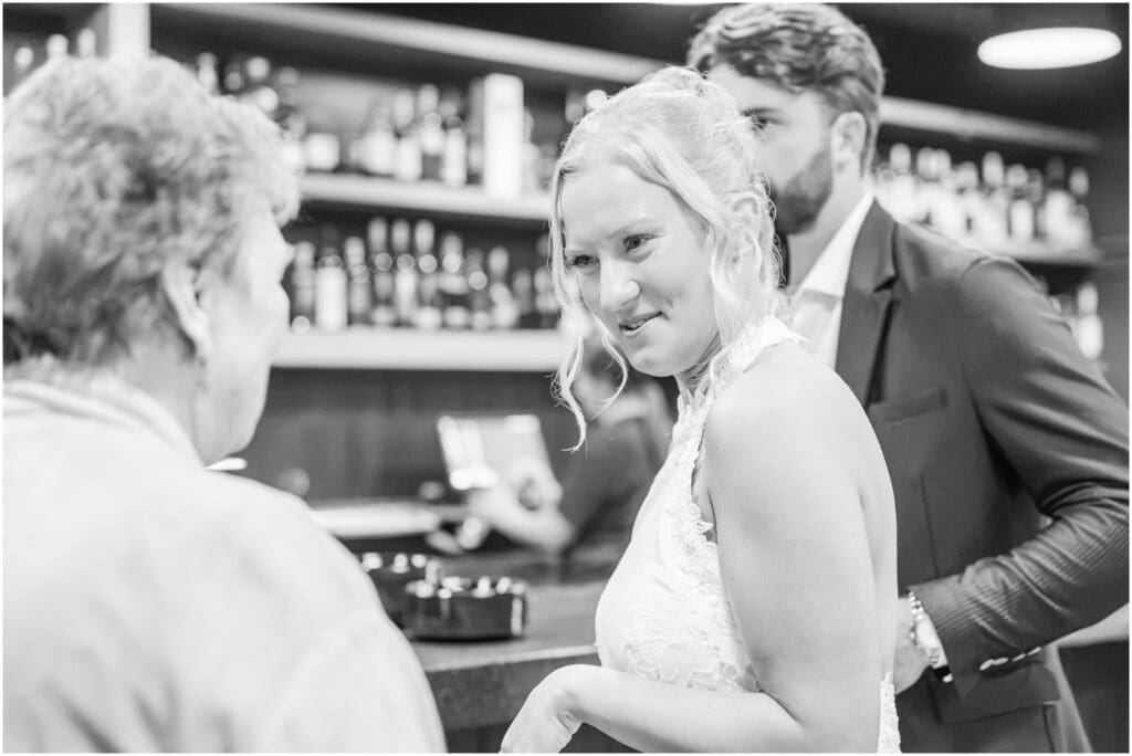 Guests enjoying dinner and speeches at an Indianapolis rehearsal dinner