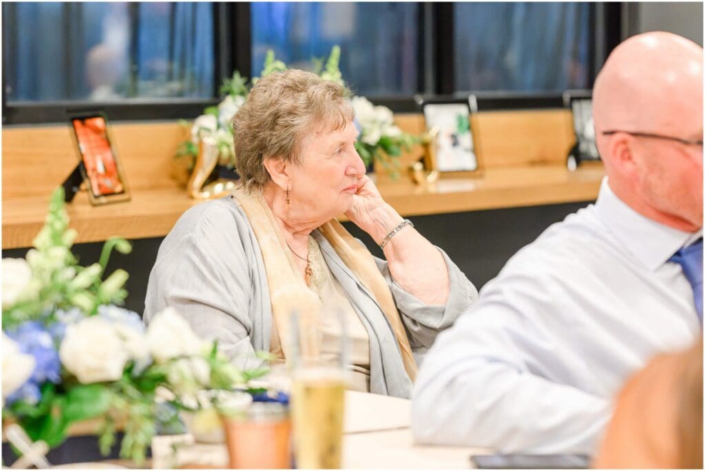 Guests enjoying dinner and speeches at an Indianapolis rehearsal dinner